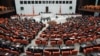 Lawmakers are seen during a debate at Turkey's parliament in Ankara, Oct. 4, 2012. Turkey fired on Syrian targets for a second day Thursday, but said it has no intention of declaring war, despite tensions after deadly shelling from Syria killed five civil