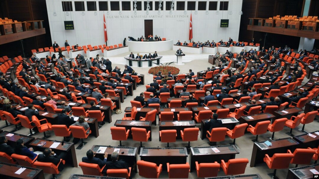 Lawmakers are seen during a debate at Turkey's parliament in Ankara, Oct. 4, 2012. Turkey fired on Syrian targets for a second day Thursday, but said it has no intention of declaring war, despite tensions after deadly shelling from Syria killed five civil