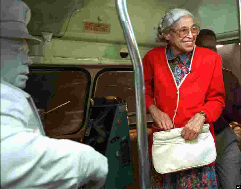 FILE - Rosa Parks visits an exhibit illustrating her bus ride of December, 1955 at the National Civil Rights Museum in Memphis, Tennessee, July 15, 1995.