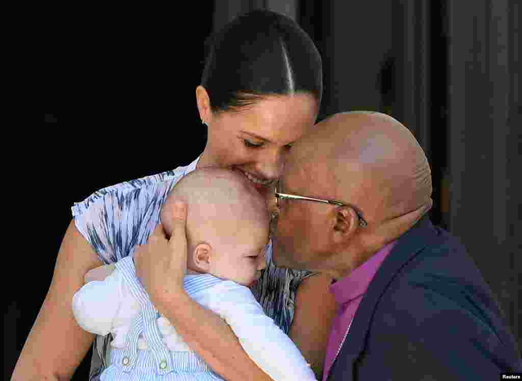 Britain's Meghan, Duchess of Sussex, holding her son Archie, meets Archbishop Desmond Tutu at the Desmond & Leah Tutu Legacy Foundation in Cape Town, South Africa.