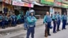FILE - Police personnel stand guard in front of the Bangladesh Nationalist Party headquarters in Dhaka on Nov. 19, 2023, during a nationwide strike called by BNP activists. The party said about half of its five million members "face politically motivated prosecution."