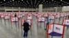 FILE - In this June 23, 2020, file photo voting stations are set up in the South Wing of the Kentucky Exposition Center for voters to cast their ballot in the Kentucky primary in Louisville, Ky. Just over four months before Election Day, President…