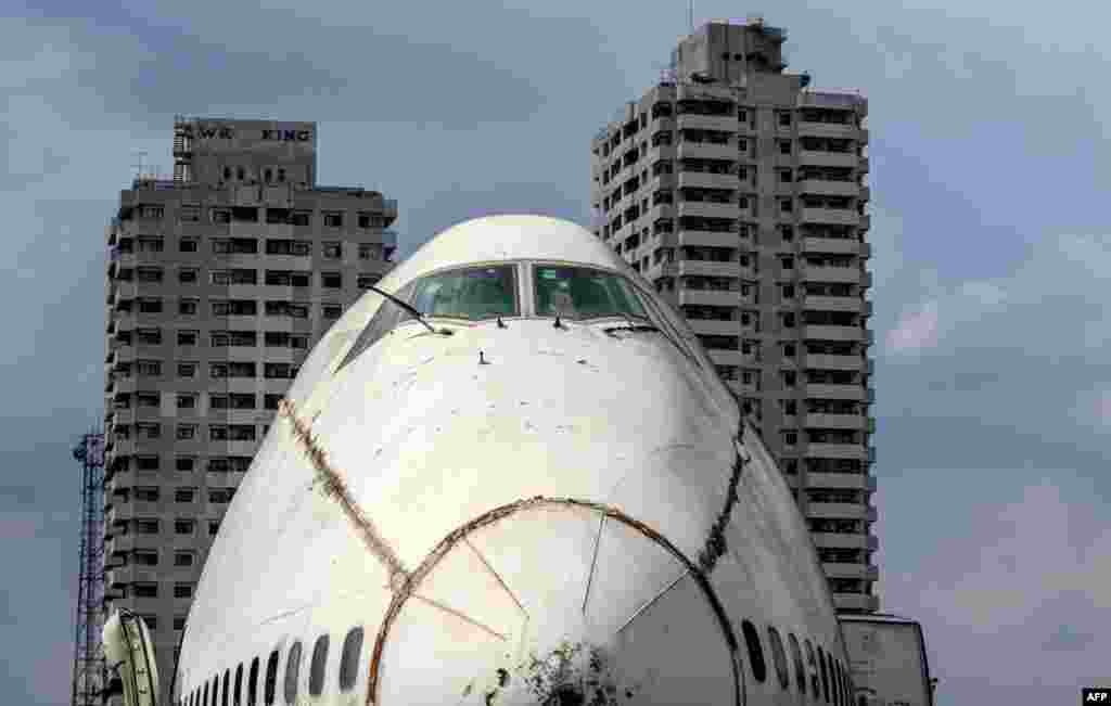 An abandoned aircraft is seen in the suburbs of Bangkok, Thailand. The area, known as the "airplane graveyard", has become a tourist attraction in the Thai capital.