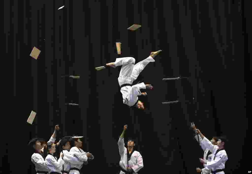 Members of the South Korean Taekwondo demonstration team perform during a visit by Bulgarian Prime Minister Boyko Borisov at Kukkiwon, the headquarters and academy of World Taekwondo, in Seoul, South Korea.
