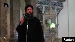 FILE - An image taken from video shows a man purported to be Abu Bakr al-Baghdadi, leader of Islamic State militants, speaking at a mosque in Mosul July 5, 2014.