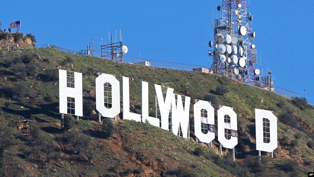 The Hollywood sign in Los Angeles, California, is seen altered Jan. 1, 2017. Los Angeles residents awoke New Year's Day to find a prankster had changed the landmark sign to read "HOLLYWEED."