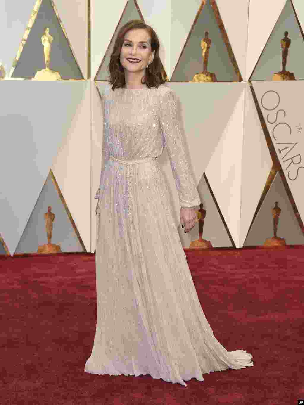Isabelle Huppert arrives at the Oscars on Sunday, Feb. 26, 2017, at the Dolby Theatre in Los Angeles.