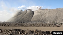 FILE - A mining machine is seen at a rare earth mine in Inner Mongolia, China, July 16, 2011. 