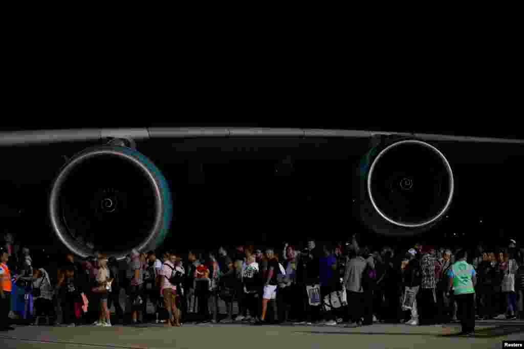 British passengers board an Airbus A380 airliner that is being used for transporting Thomas Cook customers at Dalaman Airport in Dalaman, Turkey. Thomas Cook, the world's oldest travel firm, collapsed, stranding hundreds of thousands of holidaymakers around the globe and sparking the largest peacetime repatriation effort in British history.