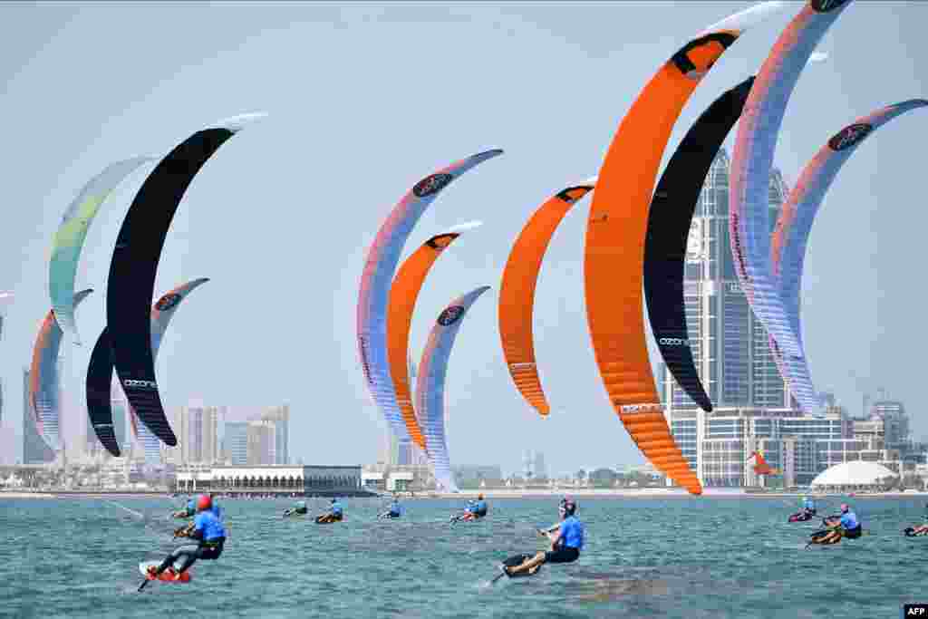 A handout picture provided by the Association of National Olympic Committees shows competitors during a kitefoil race at Doha's Katara Beach, Qatar, on the third day of the 1st ANOC World Beach Games.