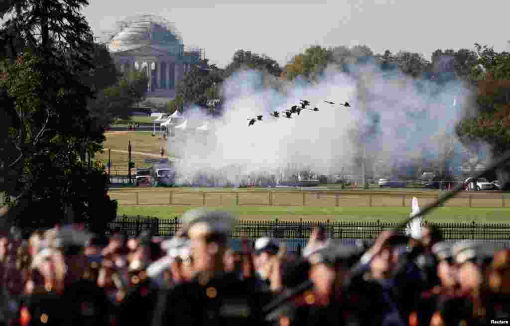 Geese take flight in front of the Jefferson Memorial as guns are fired in a salute during an official arrival ceremony for Australia's Prime Minister Scott Morrison by U.S. President Donald Trump on the South Lawn of the White House.