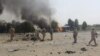 Iraqi security forces inspect the site of a car bomb attack on the outskirts of Diyala province, May 24, 2015. 
