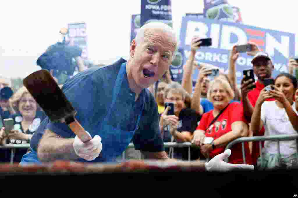 Democratic presidential candidate former Vice President Joe Biden works the grill during the Polk County Democrats Steak Fry, Sept. 21, 2019, in Des Moines, Iowa.