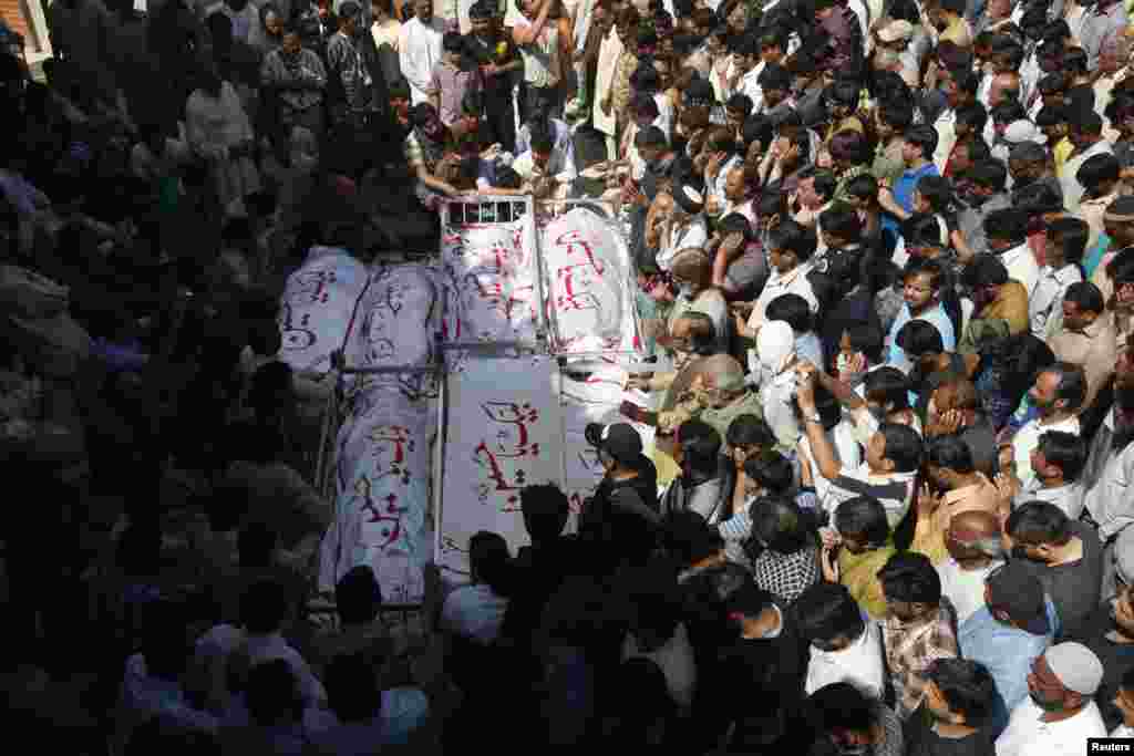 Shi'ite Muslims attend funeral prayers who those killed in a bomb attack a day earlier in Karachi, Pakistan, March 4, 2013.