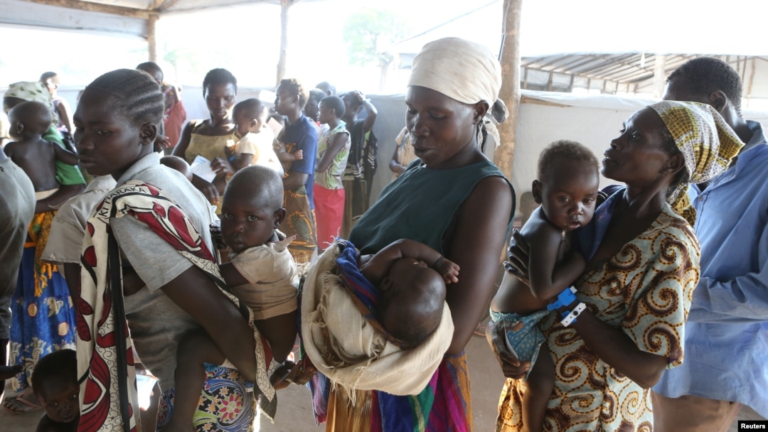 Women who fled fighting in South Sudan wait with their children for the immunization of their children on arrival at Bidi Bidi refugee’s resettlement camp near the border with South Sudan, in northern Uganda, Dec. 7, 2016.