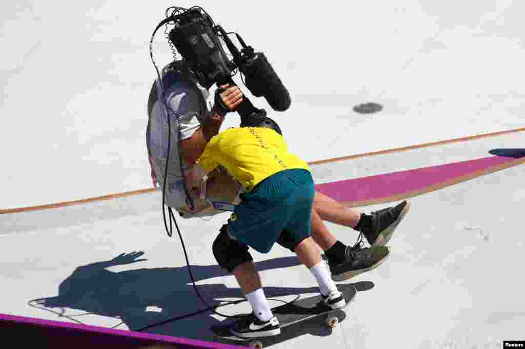 Kieran Woolley of Australia crashes into a cameraman in the men's park skateboarding preliminary round at the 2020 Summer Olympics in Tokyo, Japan.