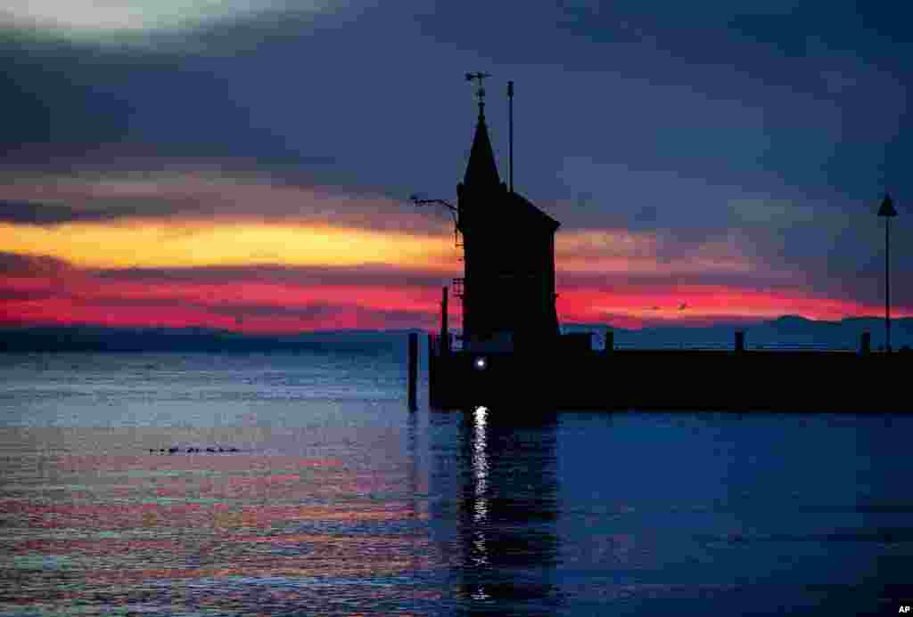 A small tower marks the entrance of the harbor of Constance, Germany.
