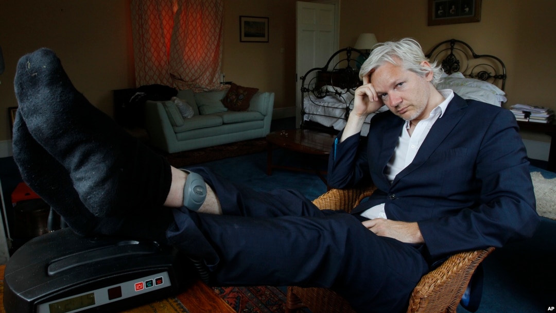 FILE - WikiLeaks founder Julian Assange is seen with his ankle security tag at the house where he is required to stay, near Bungay, England, June 15, 2011.