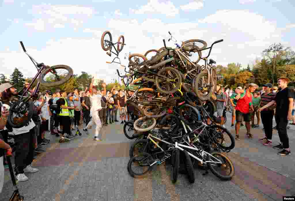 Bicycle riders place their bikes in a heap after a mass ride in Almaty, Kazakhstan.