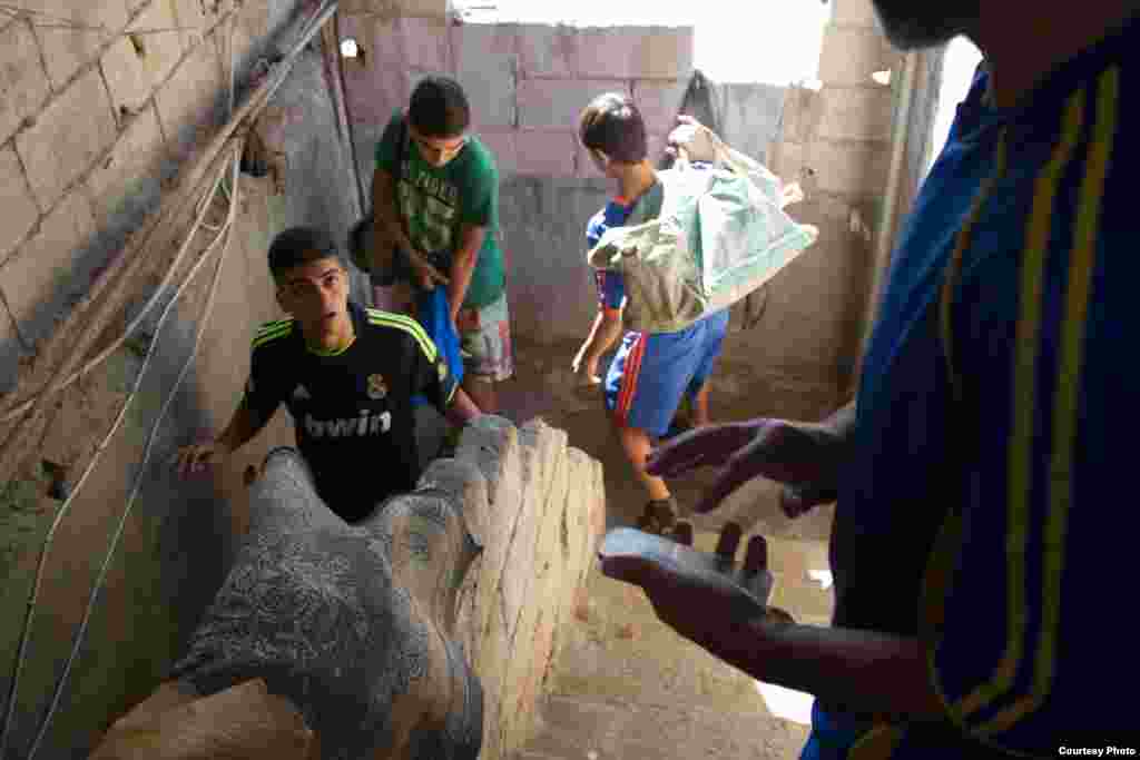 Players leave Majdi Adam’s home. The football teams train weekly and play games against other local teams, Lebanon, Dec. 2, 2014. (John Owens/VOA)