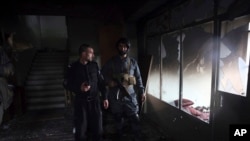 Afghan security personnel inspect a Sikh house of worship, in the aftermath of a deadly attack in Kabul, Afghanistan, Wednesday, March 25, 2020. The Interior Ministry said a lone Islamic State gunman rampaged through the Sikh place of worship,…