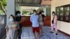This handout photo from Thailand's San Sai District Administrative Office taken May 9, 2021, and released June 2, 2021, shows five Myanmar nationals, including three Democratic Voice of Burma journalists during their arrest at a residence in Chiang Mai.