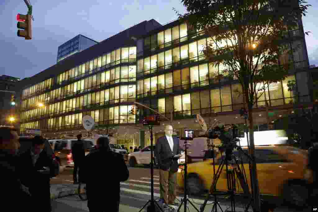 Television crews at work in front of the Bellevue Hospital after Dr. Craig Spencer, a resident of New York City and a member of Doctors Without Borders, was recently admitted, New York City, Oct. 24, 2014.
