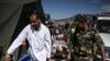 Military personnel transport a survivor of the September 8 earthquake at a military field hospital in the village of Asni near Moulay Brahim in al-Haouz province on September 11, 2023. (Philippe Lopez/AFP)