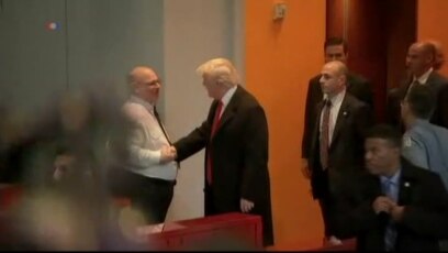 Crowd Reacts as Trump Leaves NY Times Meeting