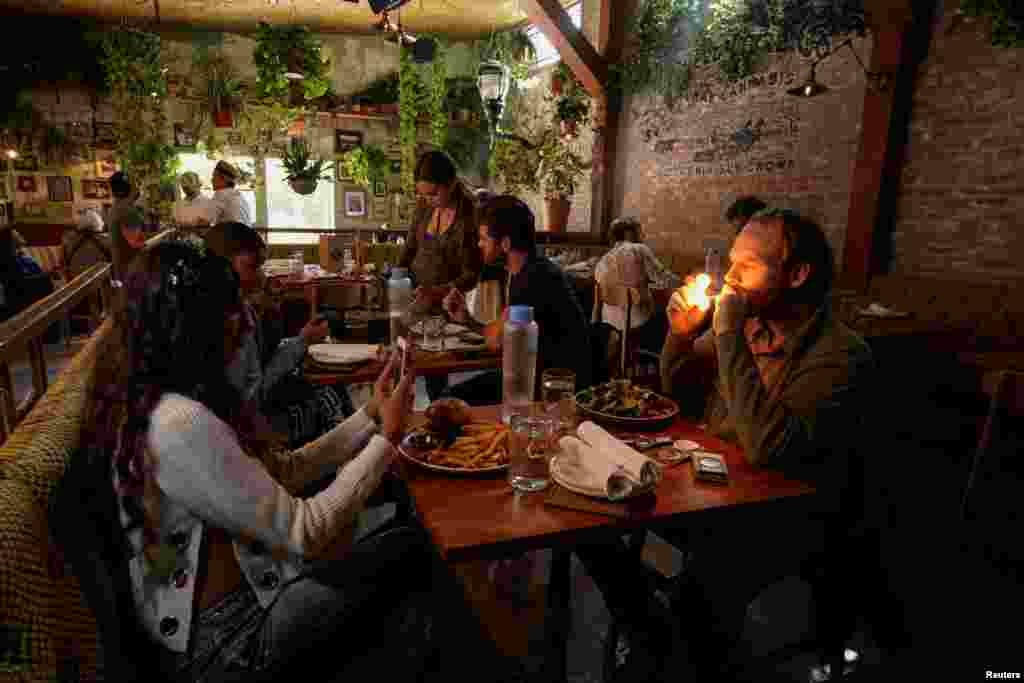 Customers smoke at Lowell Farms, America's first official Cannabis Cafe offering farm-to-table dining and smoking of cannabis in West Hollywood, California, Oct. 1, 2019.