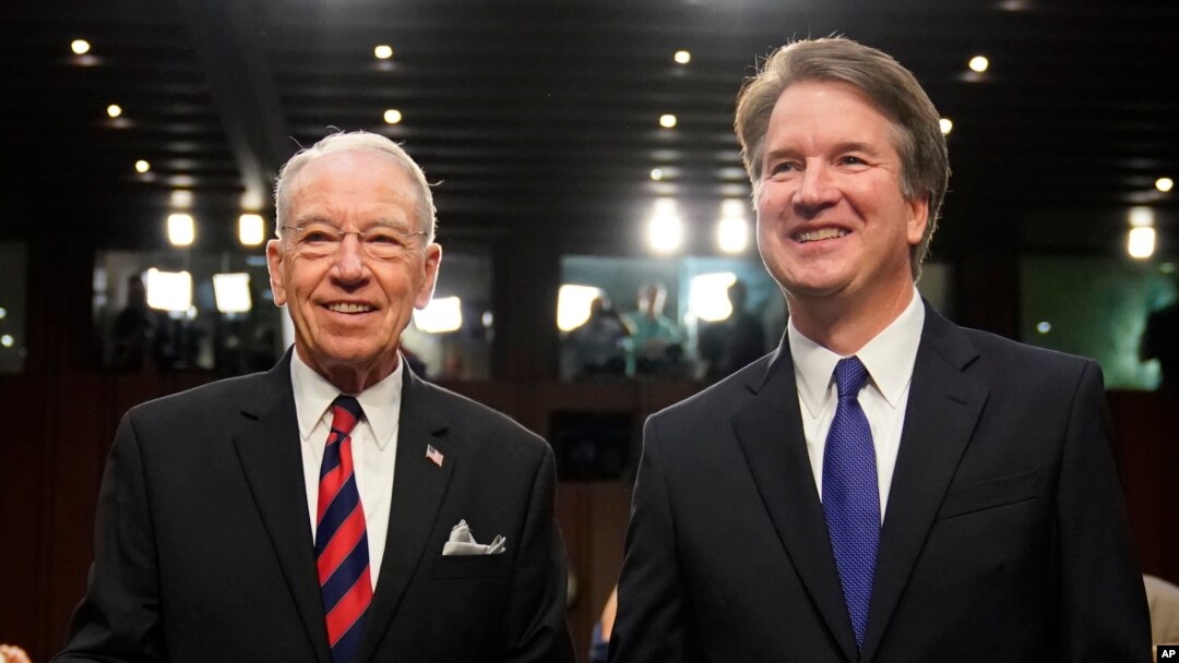 Supreme Court nominee Brett Kavanaugh, standing with Senate Judiciary Chairman Chuck Grassley, R-Iowa, arrives at the Senate Judiciary Committee on Capitol Hill, Sept. 4, 2018, in Washington, to begin his confirmation hearing to replace retired Justice Anthony Kennedy.